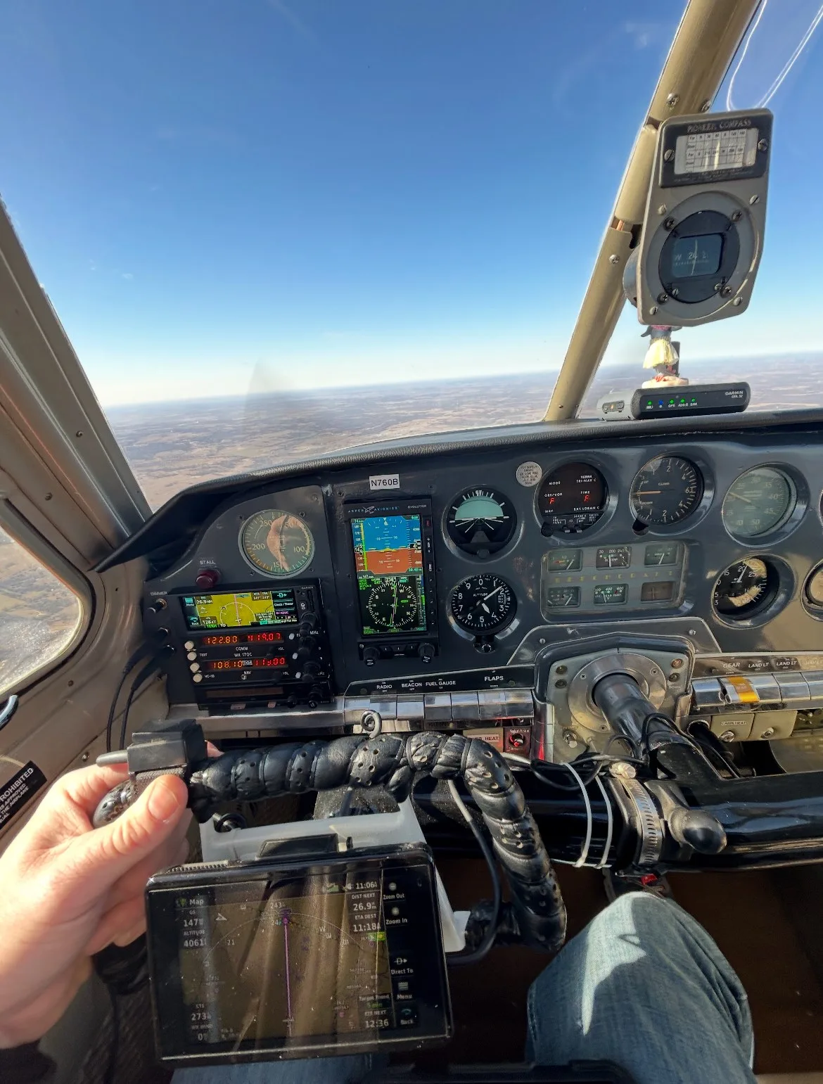 A pilot's view from the cockpit of N760B, showing the instrument panel and controls during flight.