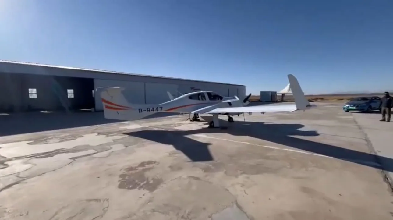 Side view of a Diamond DA42 aircraft parked on the tarmac.