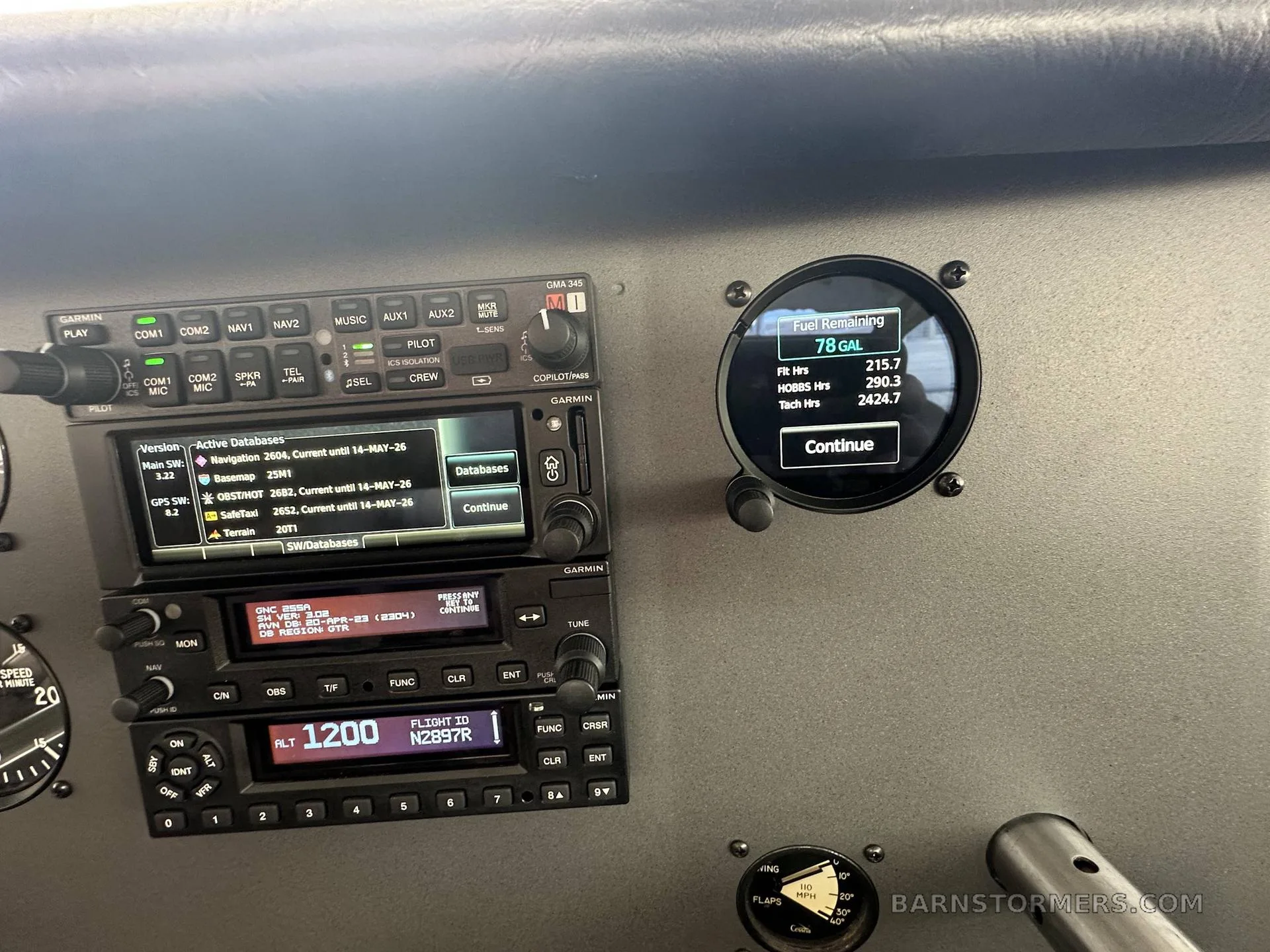 A close-up of the avionics stack and a digital fuel remaining gauge showing 78 gallons in the cockpit of a Cessna.
