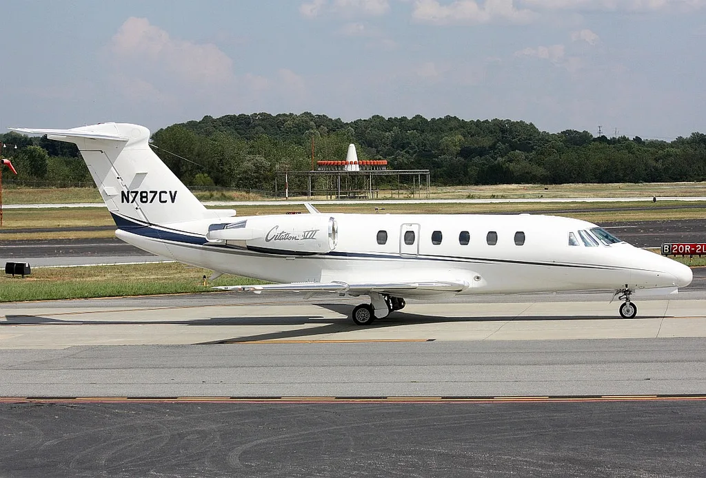 A Citation III aircraft with registration N787CV on the tarmac.