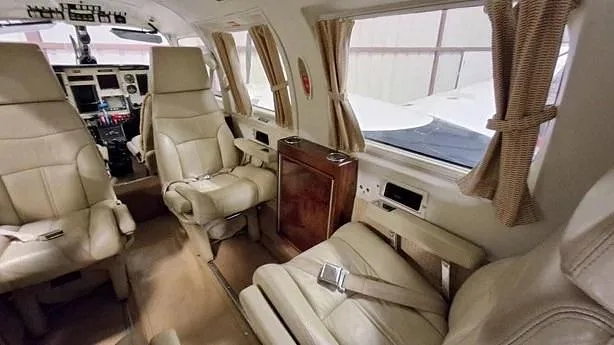 Another view of the cabin interior showing seating and amenities.