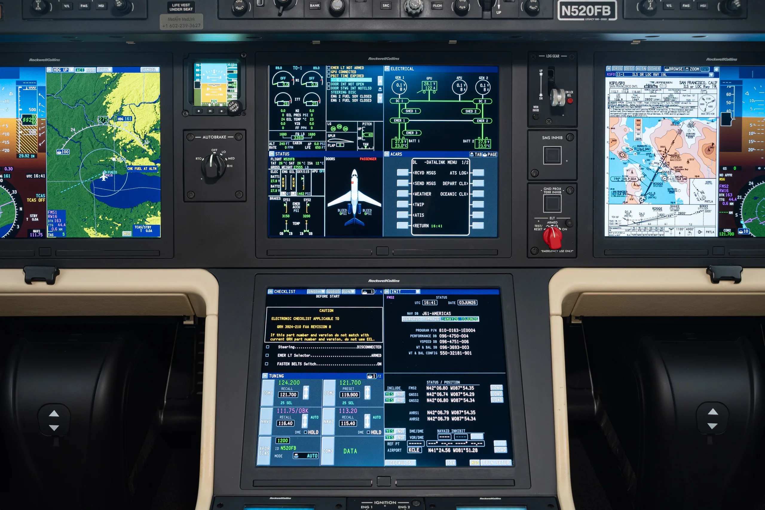 A detailed view of a modern aircraft cockpit's instrument panel, featuring multiple large digital displays.
