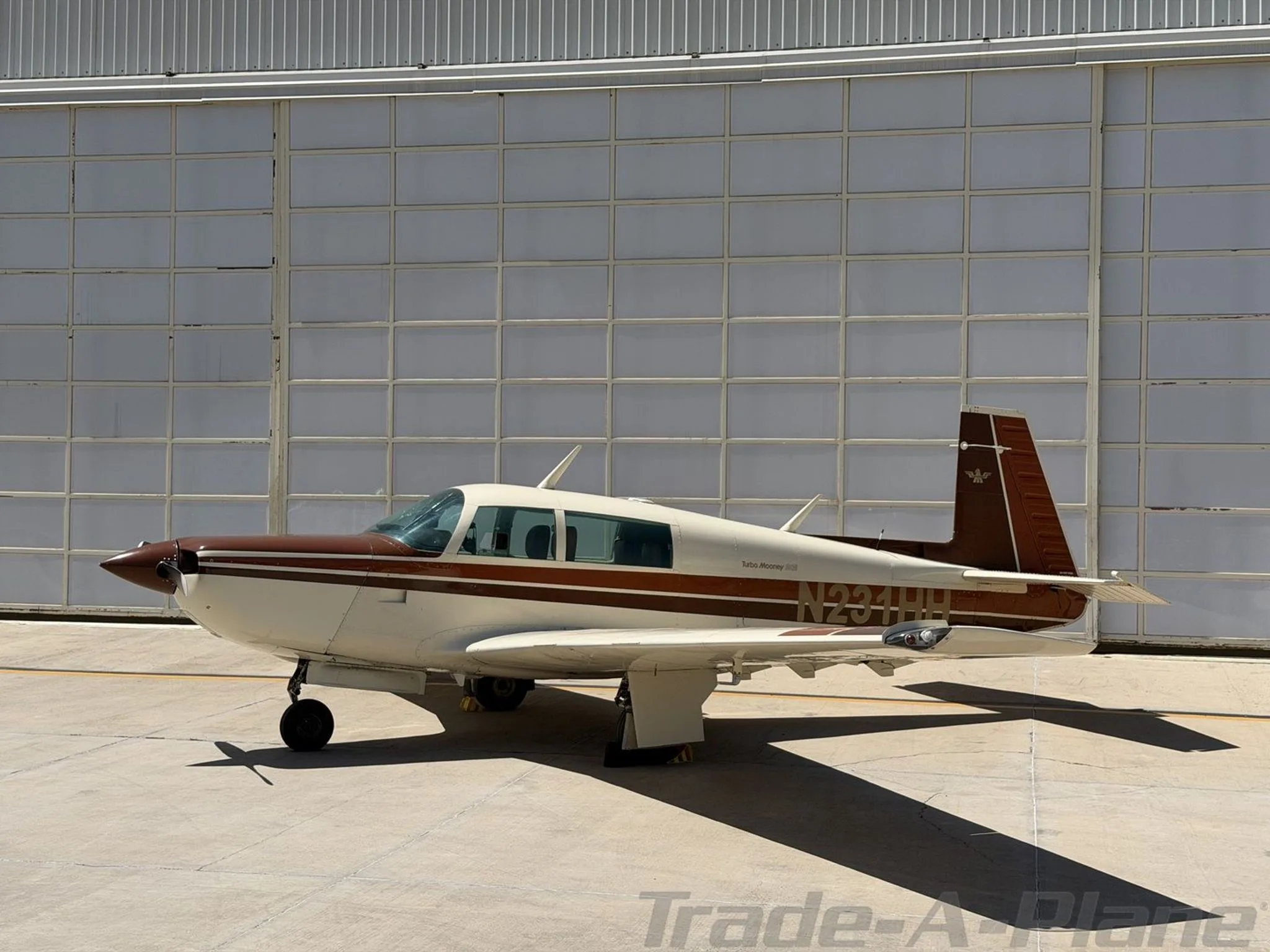 Another angle of the Mooney M20K 231 at the hangar.