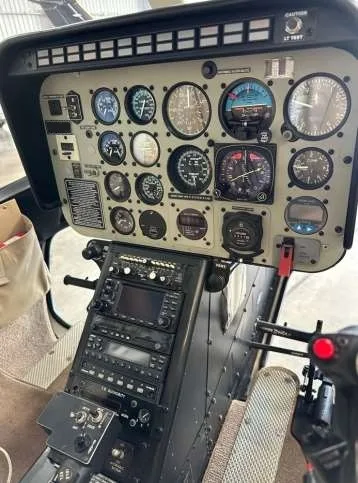 Close-up of the helicopter's instrument panel and controls.