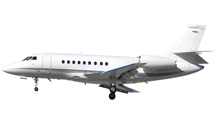 A white Dassault Falcon business jet in side profile with landing gear extended against a blue sky.