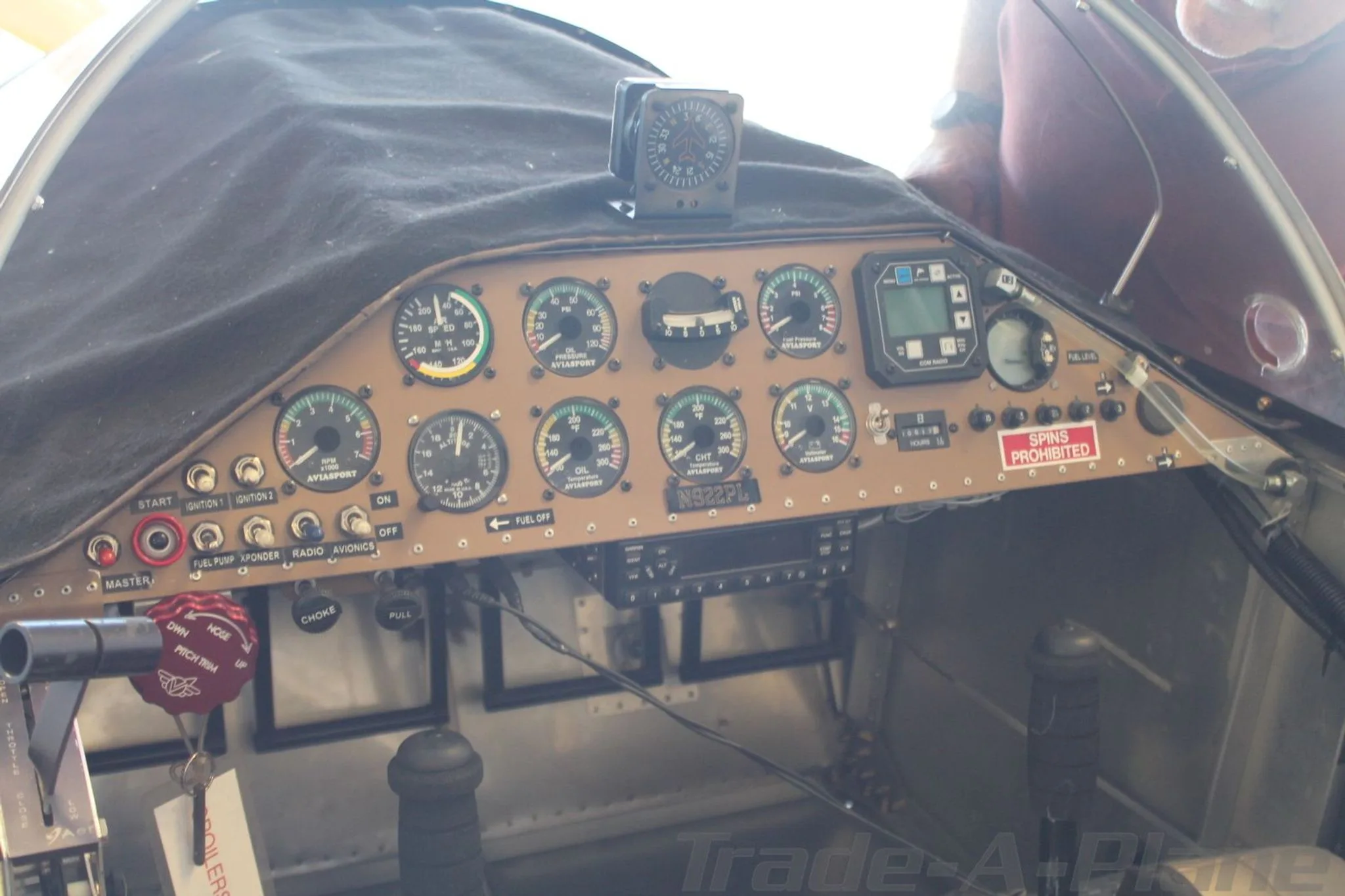 The instrument panel of an aircraft, showing various gauges, switches, and the tail number N922PL.