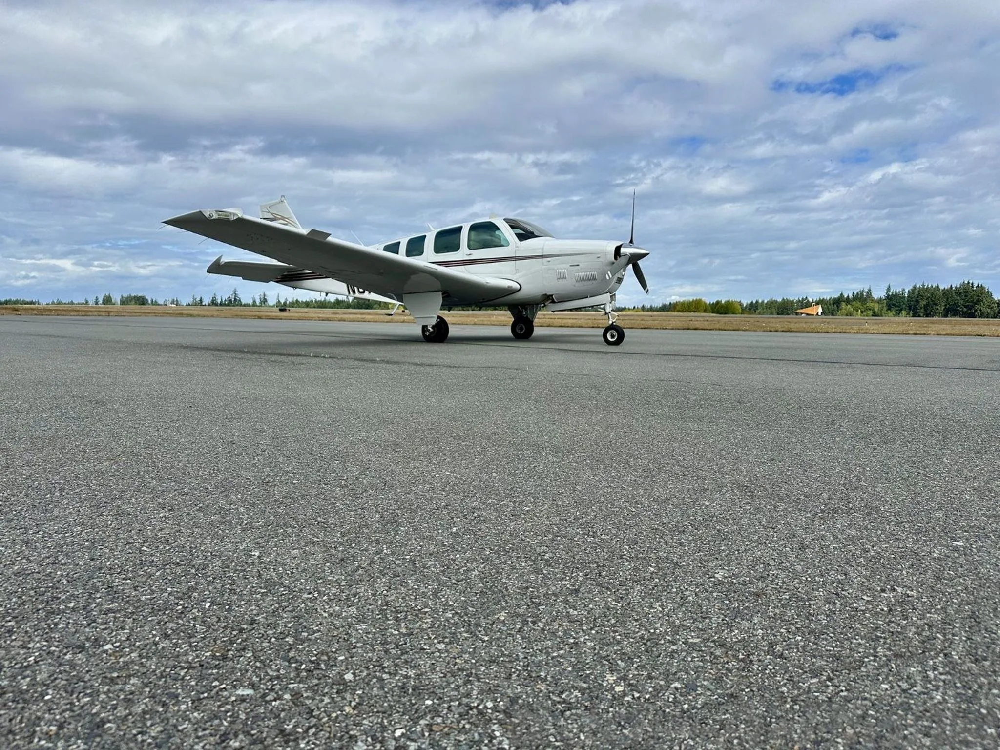 Low angle view of the Beechcraft B36TC Bonanza on the runway.