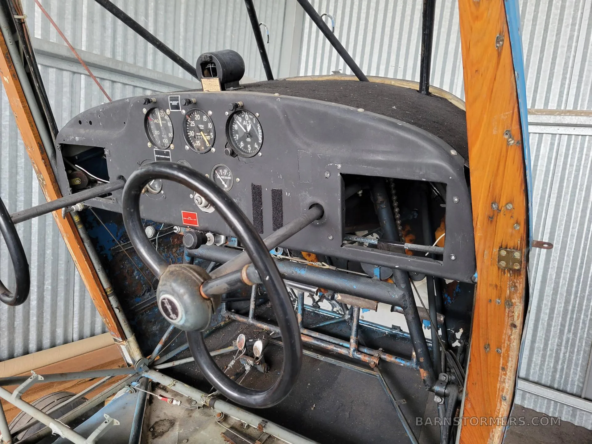 The instrument panel and steering yoke of a partially assembled aircraft.