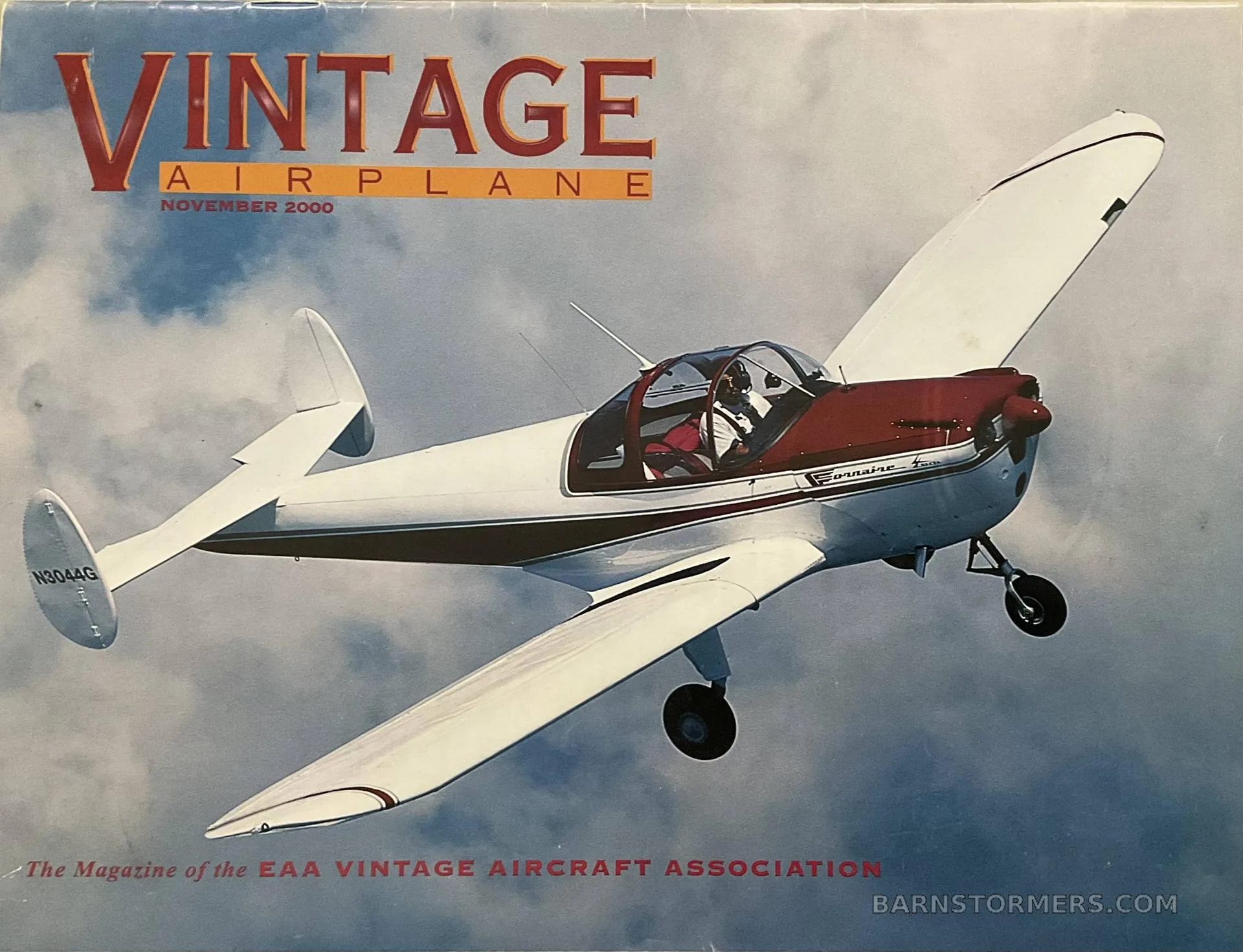 A white and maroon Ercoupe 415-C aircraft with tail number N304G is shown in flight on a magazine cover.