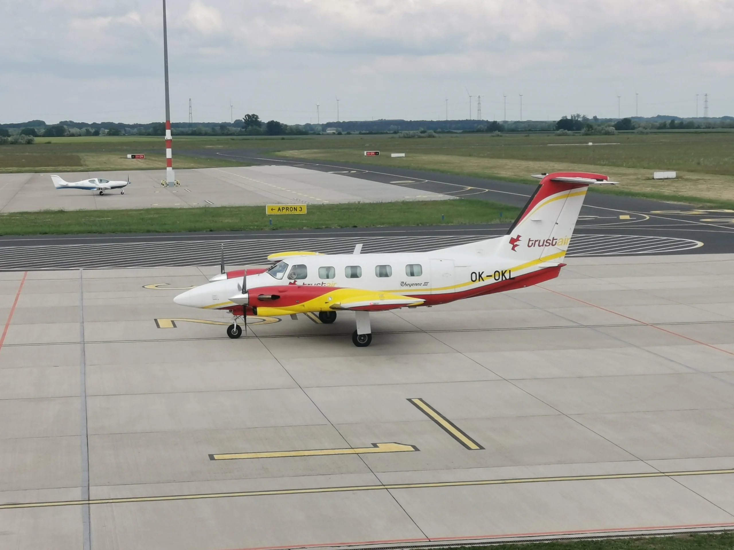 Cheyenne III aircraft OK-OKL parked on the tarmac at an airport.