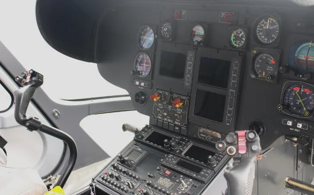 Close-up of the helicopter's instrument panel and controls.