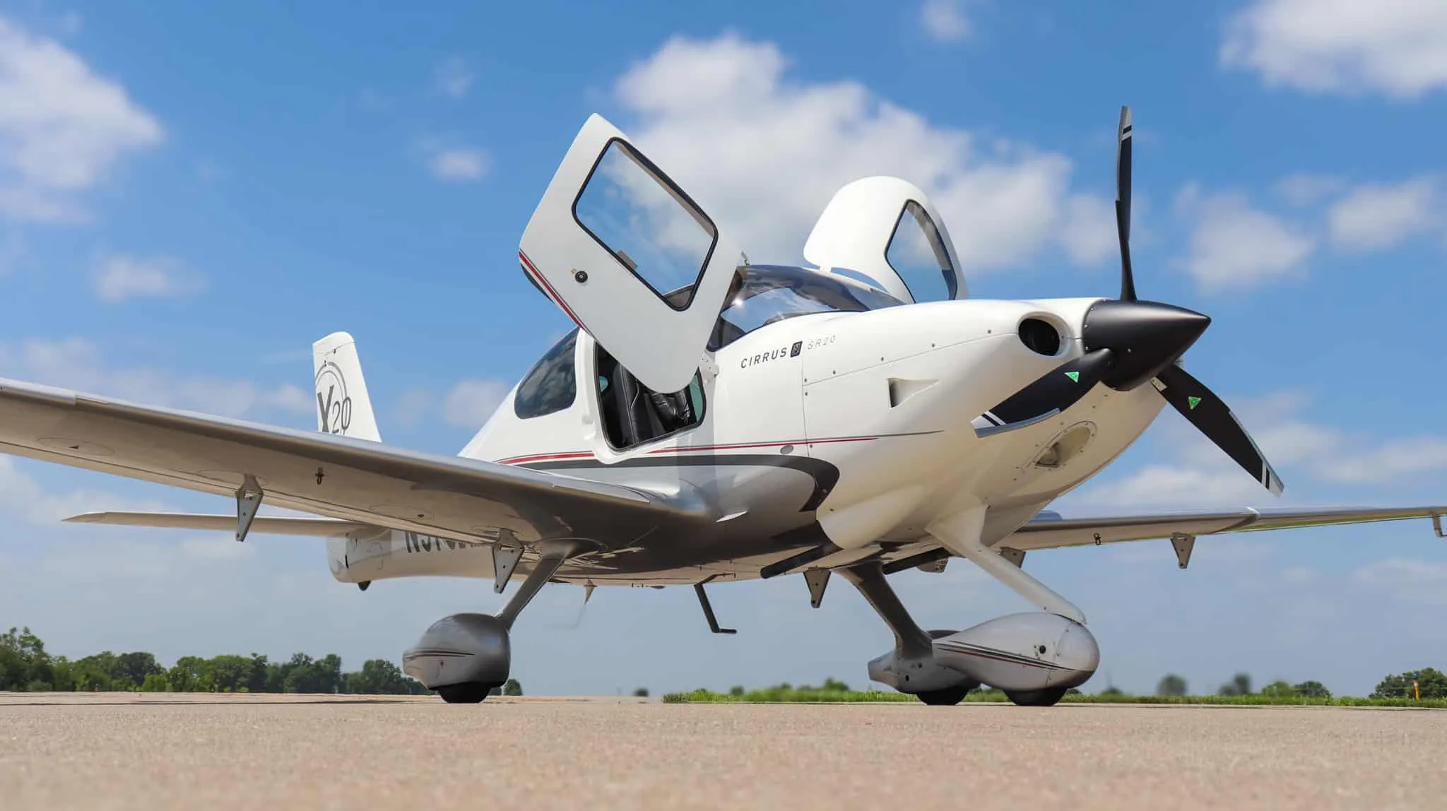 A detailed view of the Cirrus SR20 cockpit with dual Garmin G1000 displays and controls.