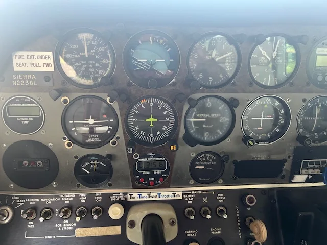 Close-up view of the aircraft's main instrument panel with various gauges and controls.