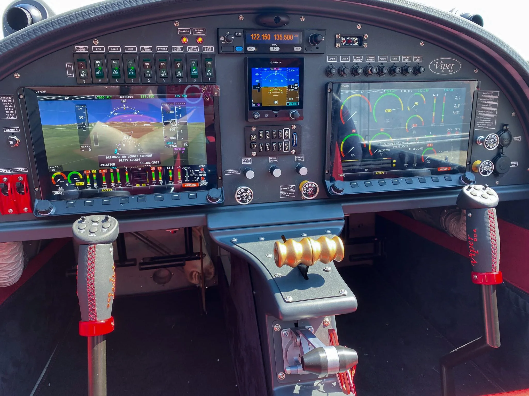 The modern glass cockpit of a Viper SD4 light sport aircraft, featuring multiple digital displays and controls.