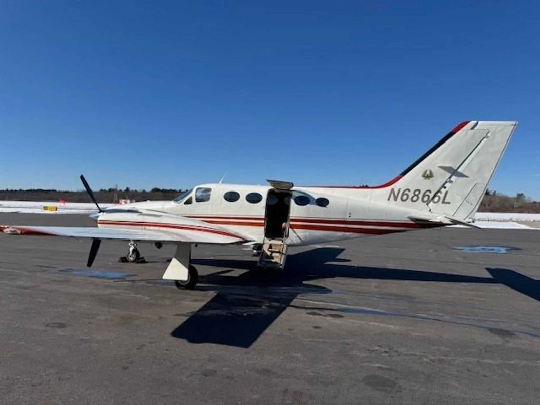 A side view of the aircraft on the tarmac.