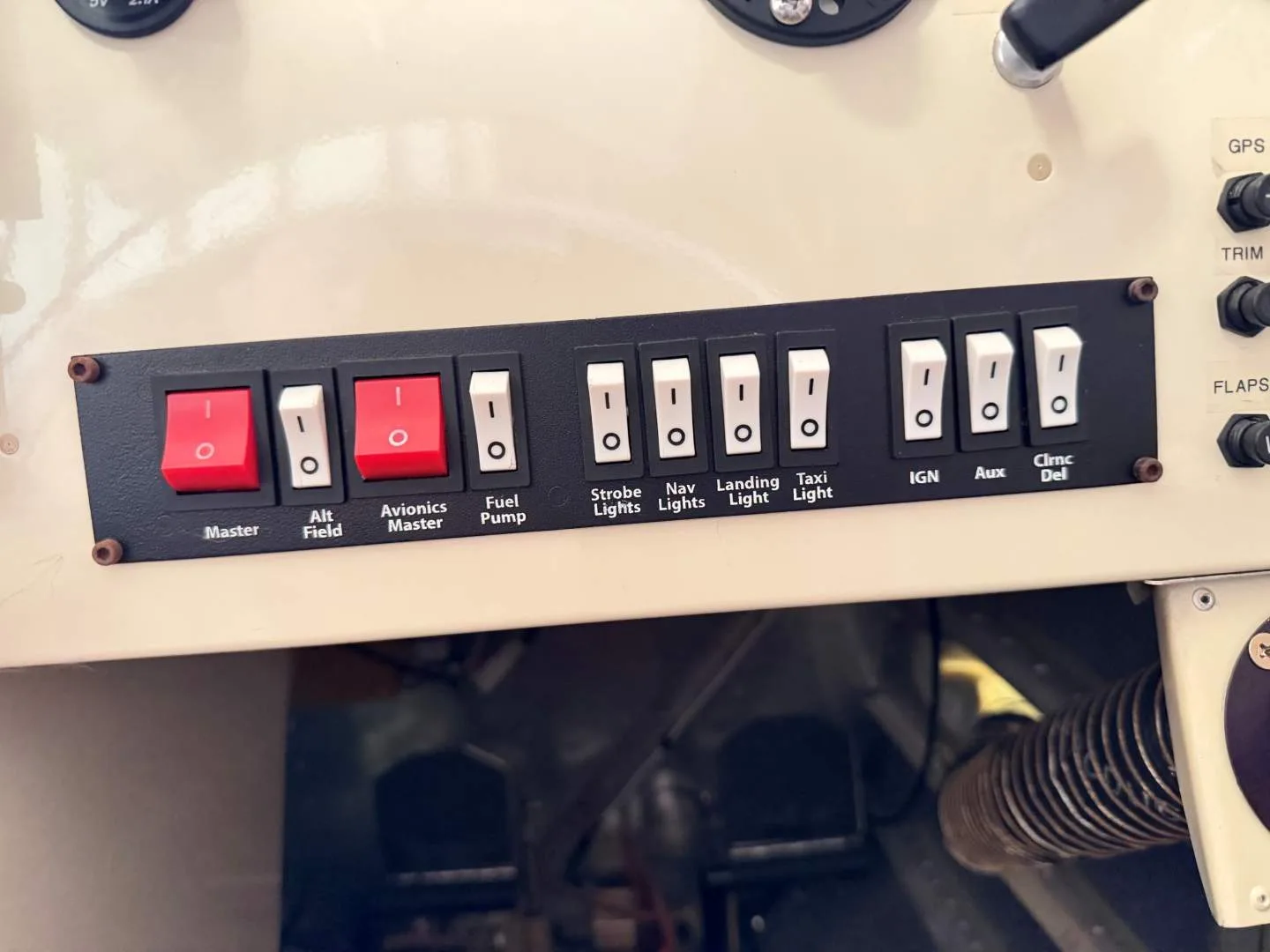 A close-up of the aircraft's switch panel with various labeled toggle switches.