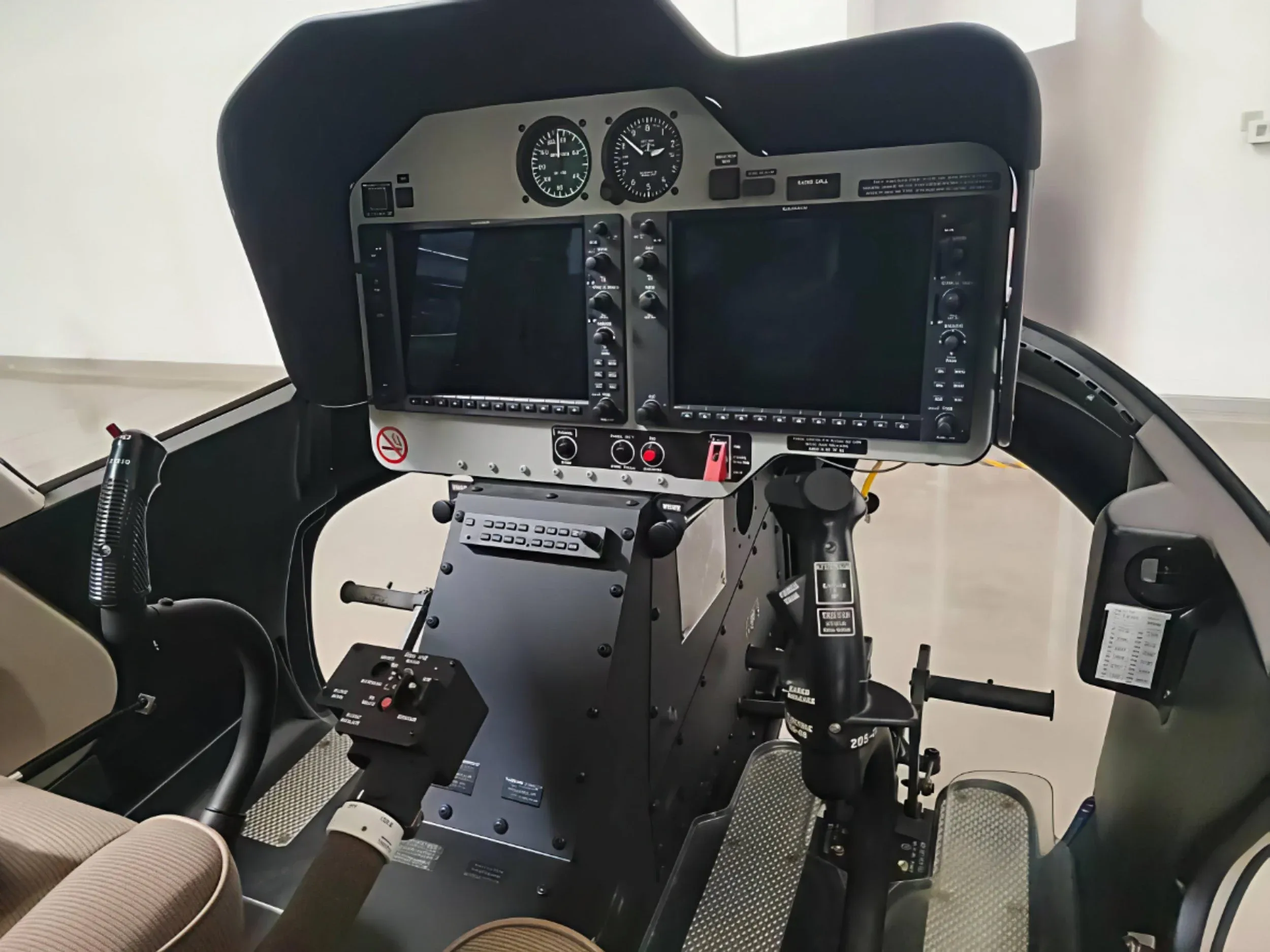 The instrument panel and controls of a helicopter cockpit.