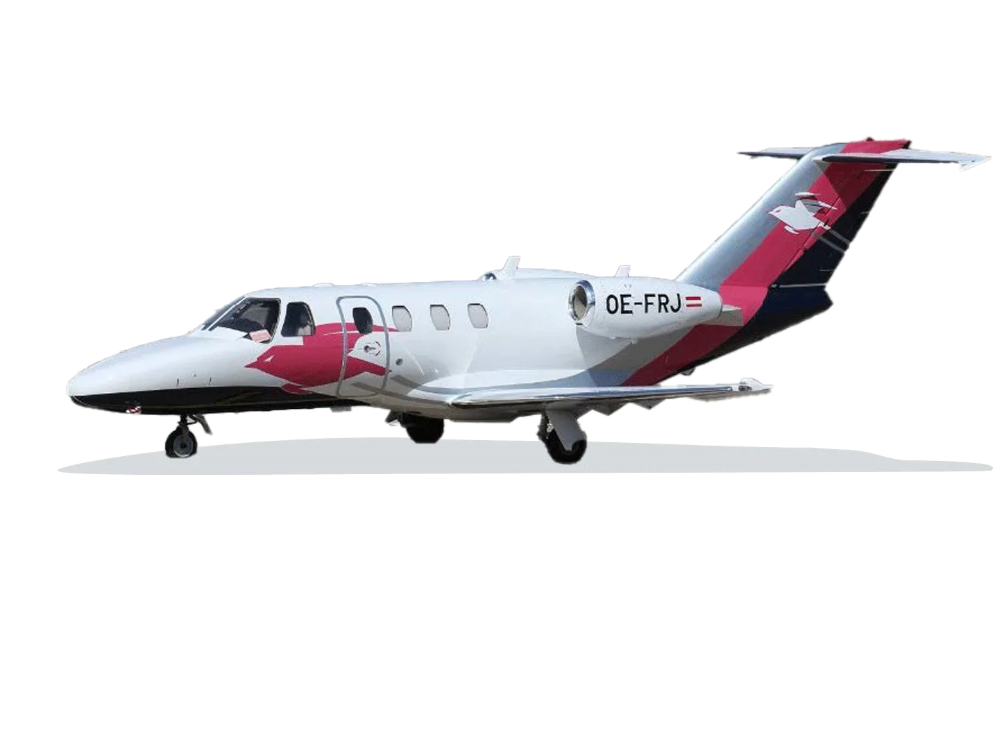 A white Cessna CitationJet (OE-FRJ) with a distinctive red, black, and grey livery and a bird logo on the tail, viewed from the side.