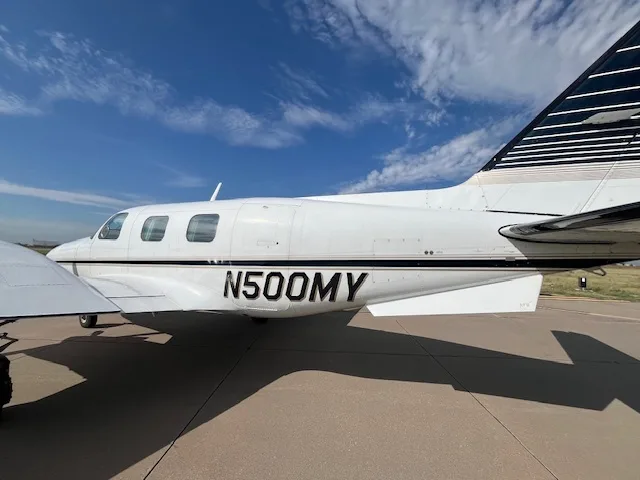 A side profile of the Piper Cheyenne I showing its registration number.