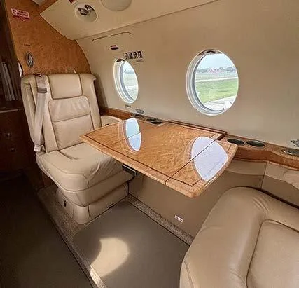 Detailed view of a seat with a table in the cabin.