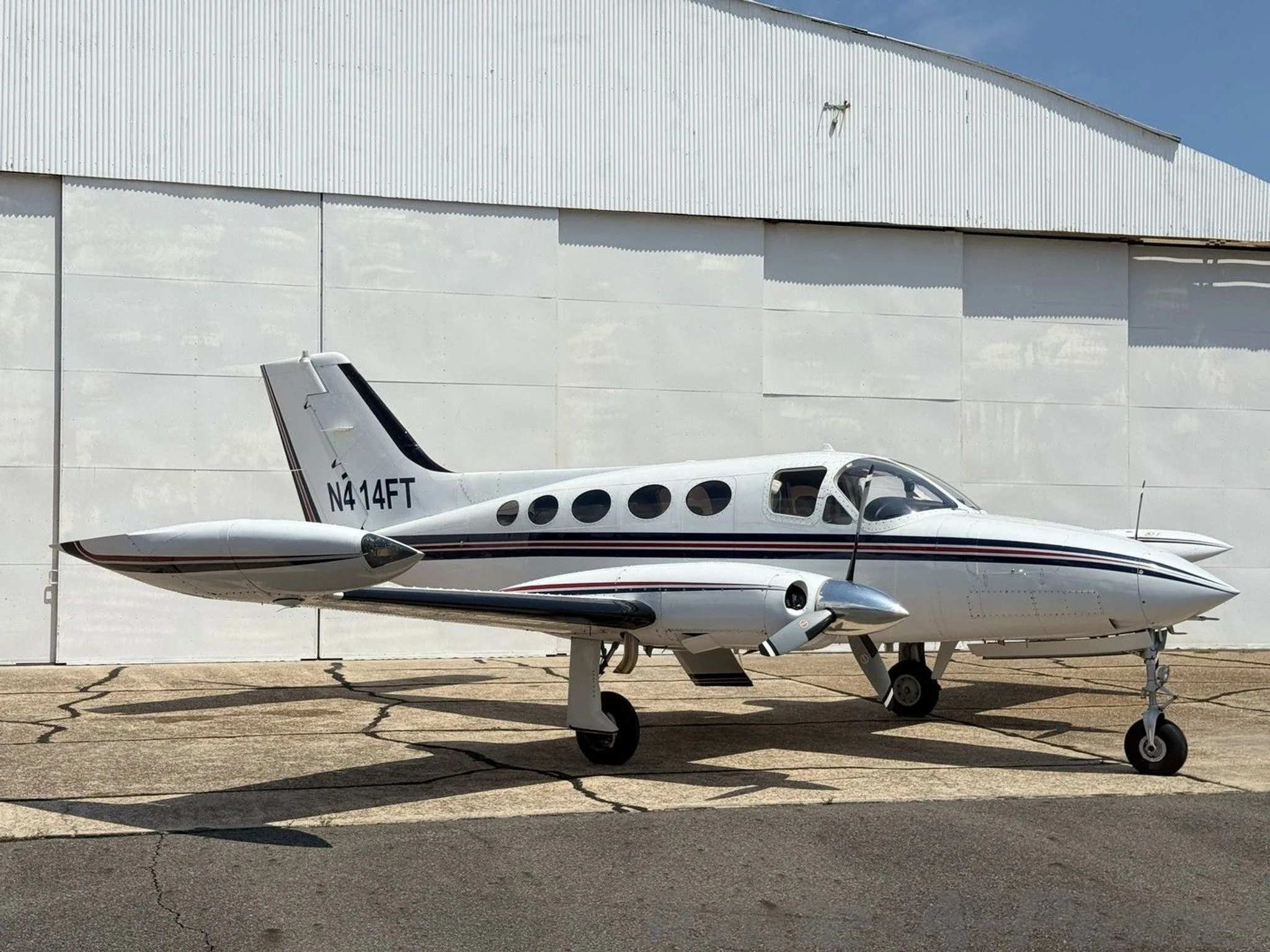 Side view of the Cessna 414 with registration number N414FT.