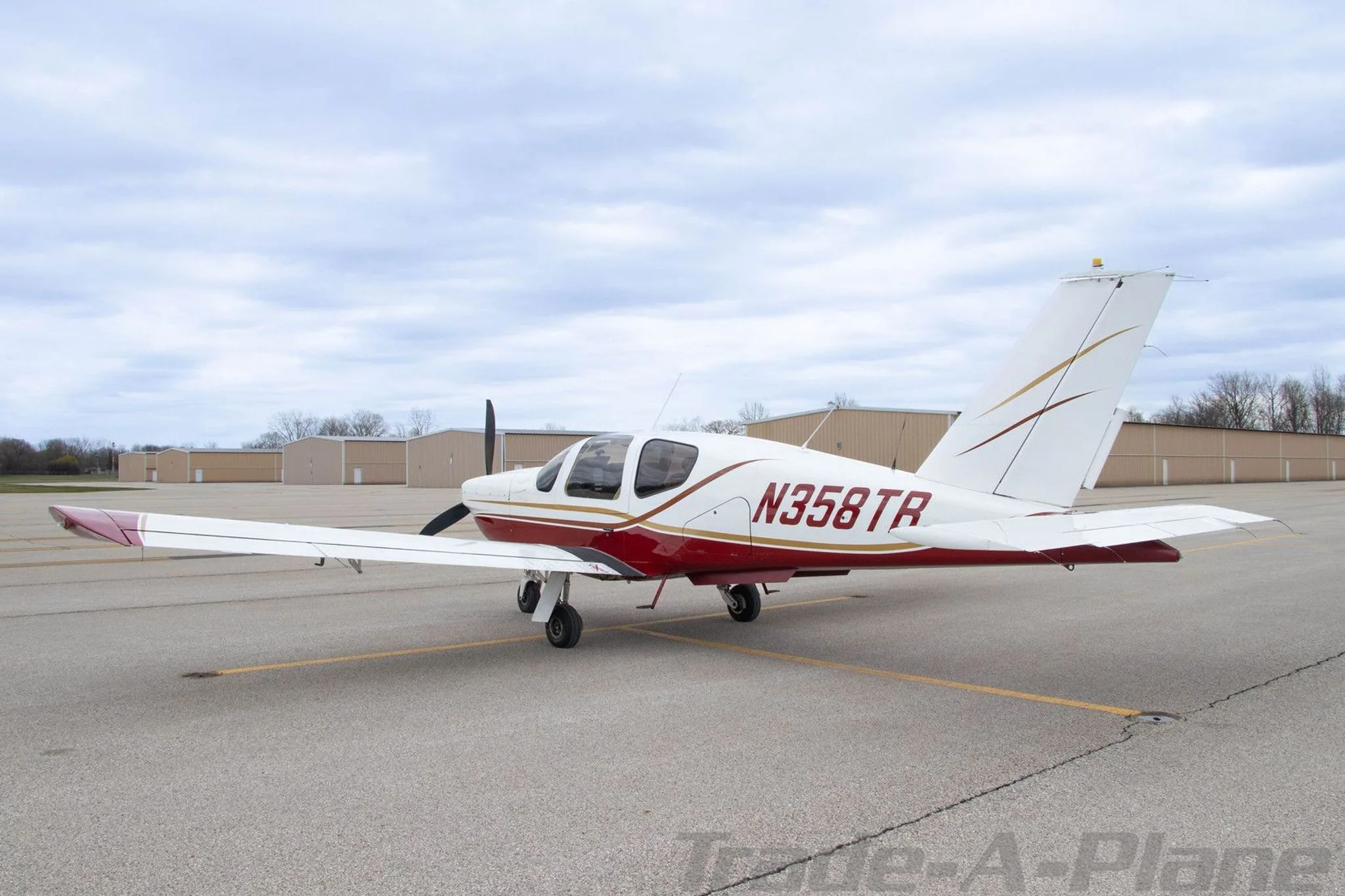 Side view of the aircraft parked on the tarmac.