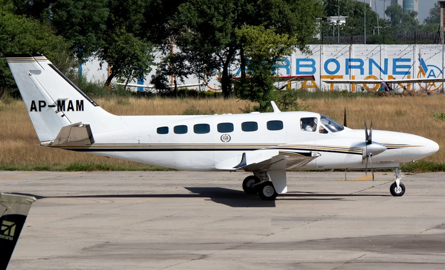 A Cessna 404 Titan aircraft is shown on the ground.