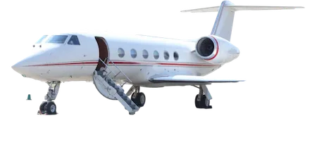A white business jet with a red stripe, parked on the ground with its airstairs deployed.