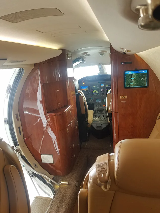 Interior view of the aircraft showing the cockpit and cabin.