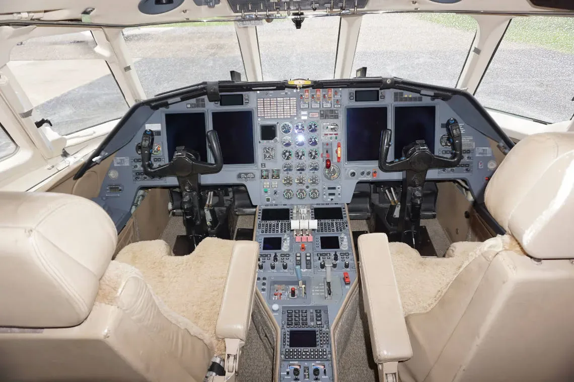 The cockpit of the aircraft features dual controls and a full instrument panel.