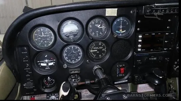 A close-up view of the left side of a Cessna 172 instrument panel, showing flight instruments.
