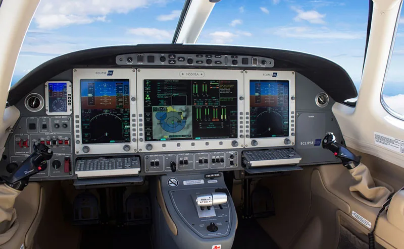 The cockpit of an Eclipse 550 jet, showing the instrument panel and controls.
