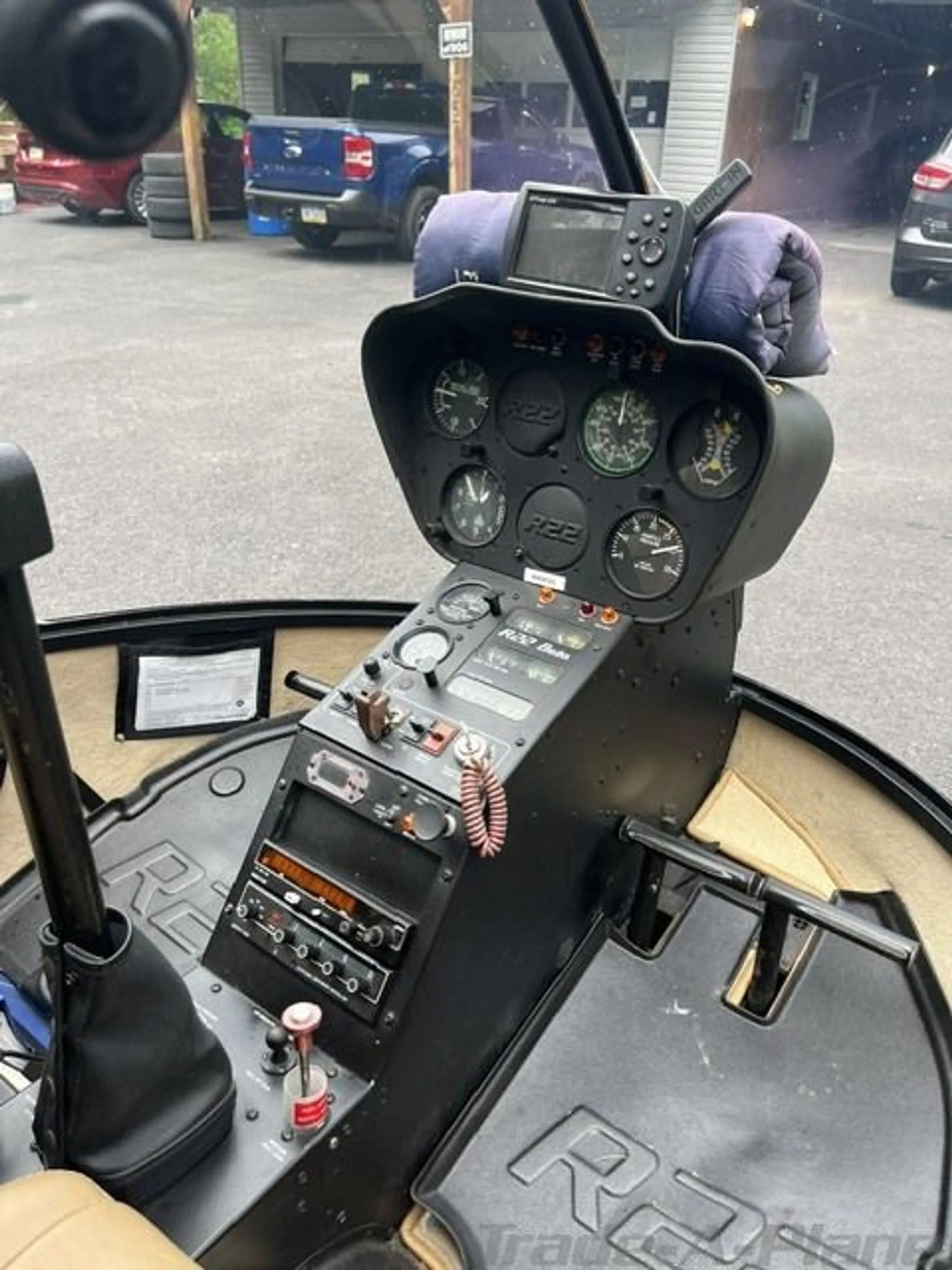 The instrument panel and controls of a helicopter cockpit.