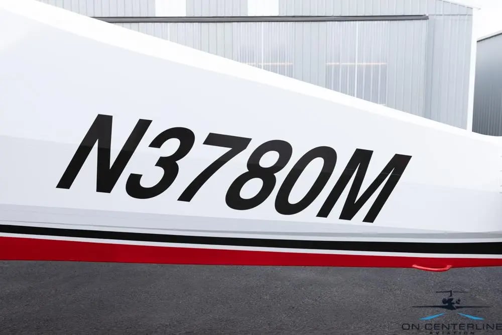 Close up of the N3780M registration number on the aircraft's fuselage.