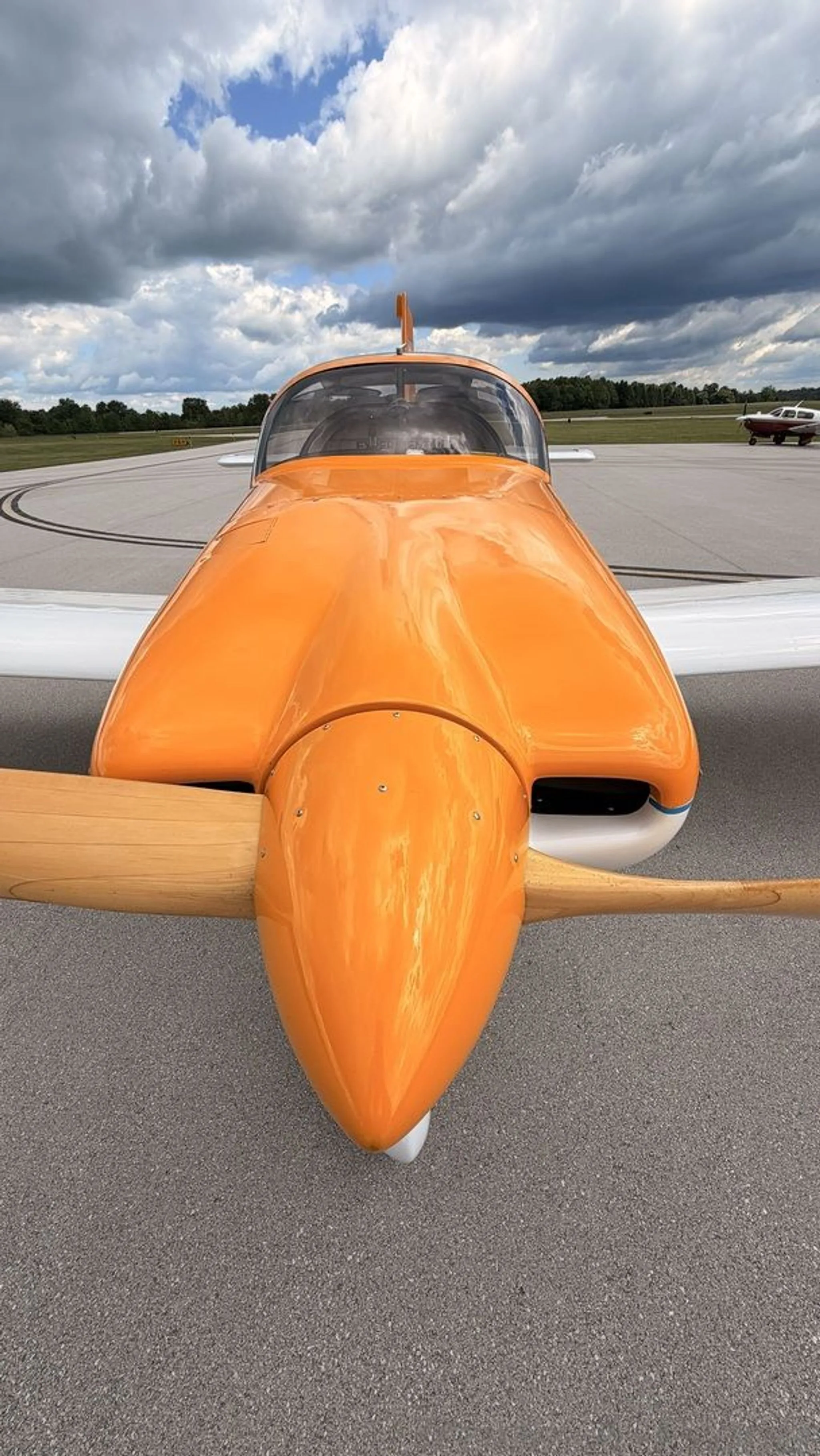 A close-up view of the aircraft's nose and propeller.