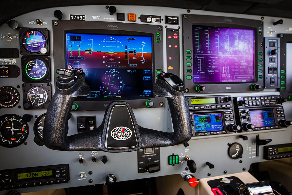 The instrument panel and controls of a Meridian aircraft cockpit.