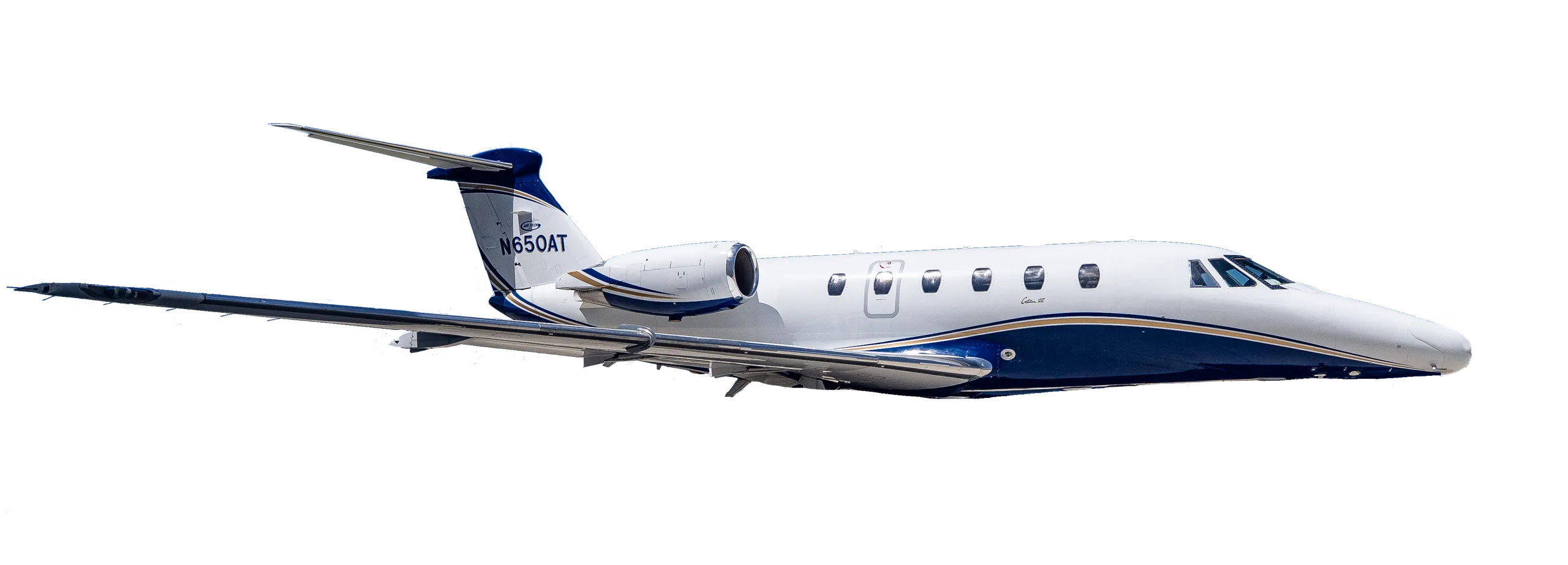 A white business jet with blue and gold stripes and tail number N650AT, viewed from the side.