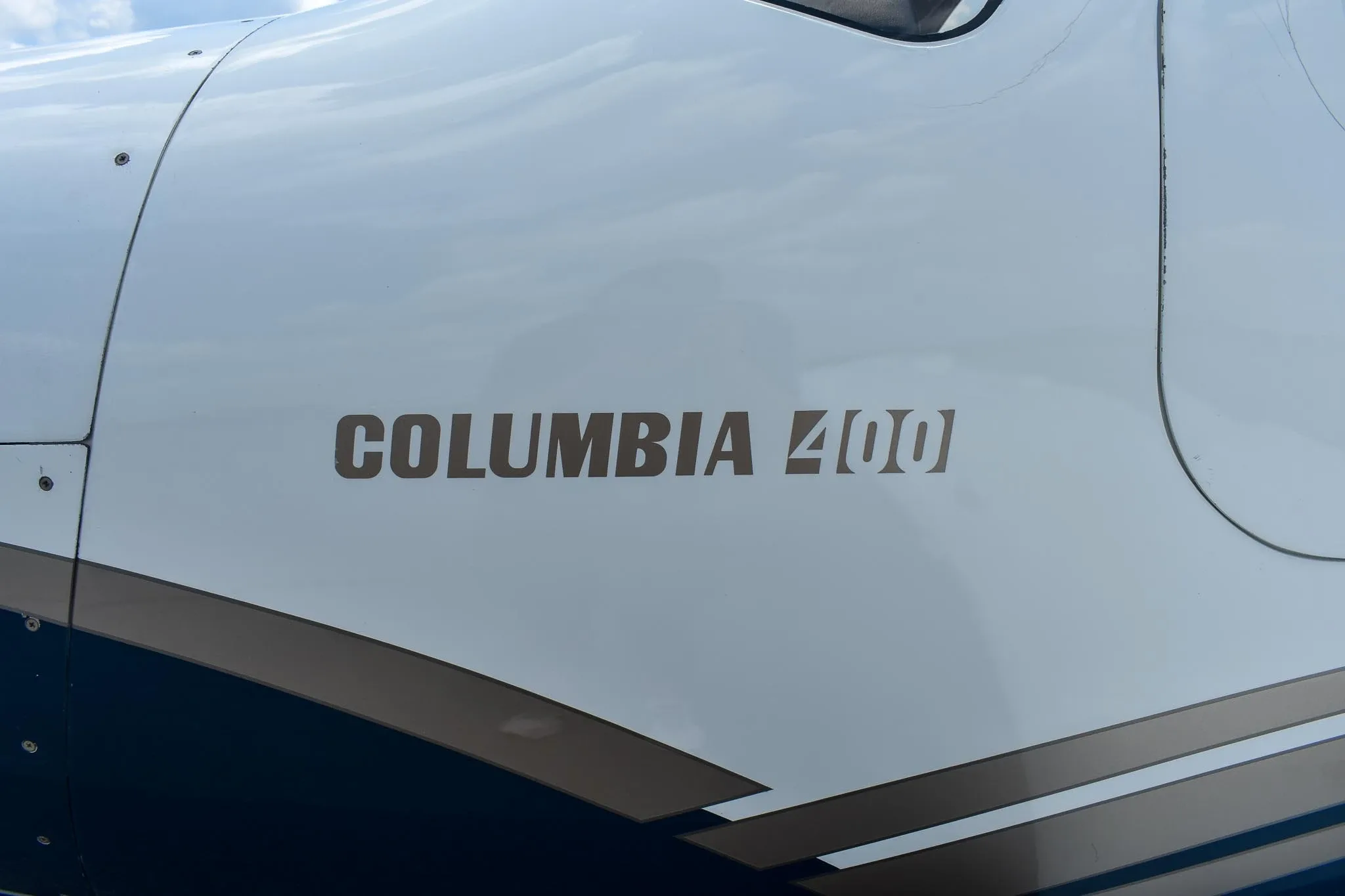 A close-up view of the fuselage showing "COLUMBIA 400" painted on the side of the aircraft.