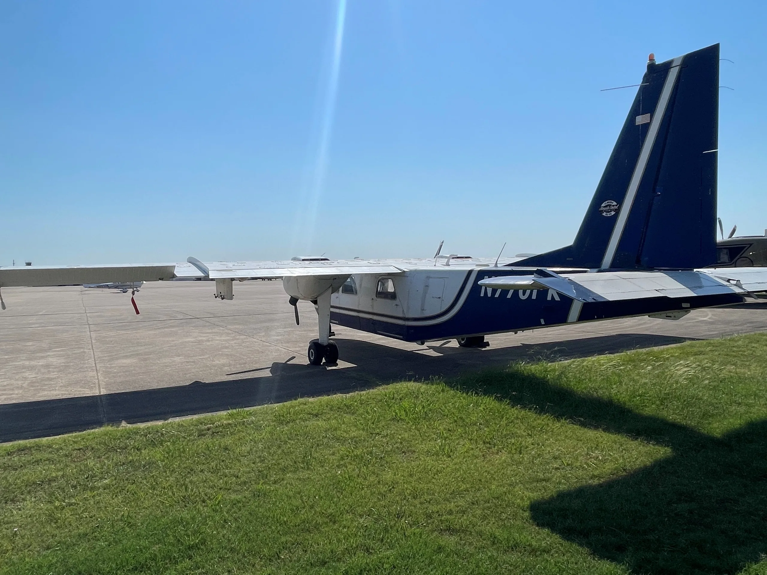 Rear view of aircraft N770FK on the tarmac.