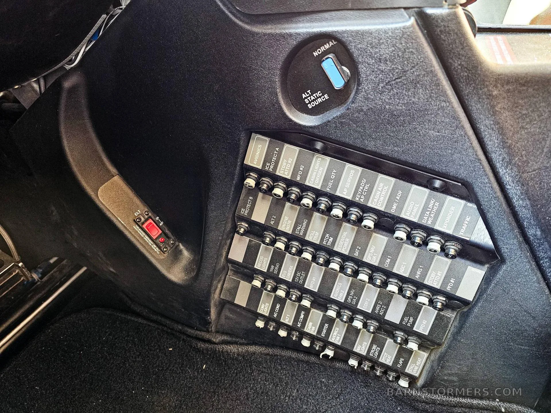 A close-up view of an aircraft's fuse panel and switches, including an "ALT STATIC SOURCE" selector.
