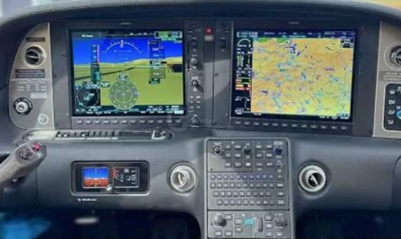 The modern glass cockpit of a Cirrus SR22, featuring multiple digital displays and controls.