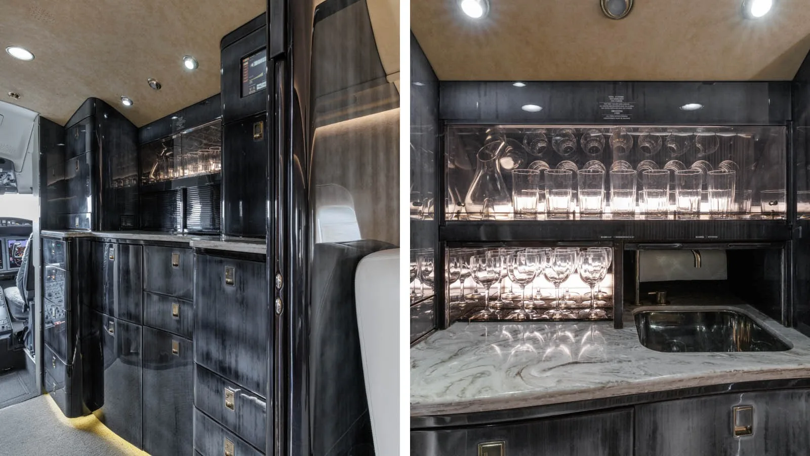 A luxurious aircraft galley with dark wood cabinetry, a marble countertop, and glassware storage.