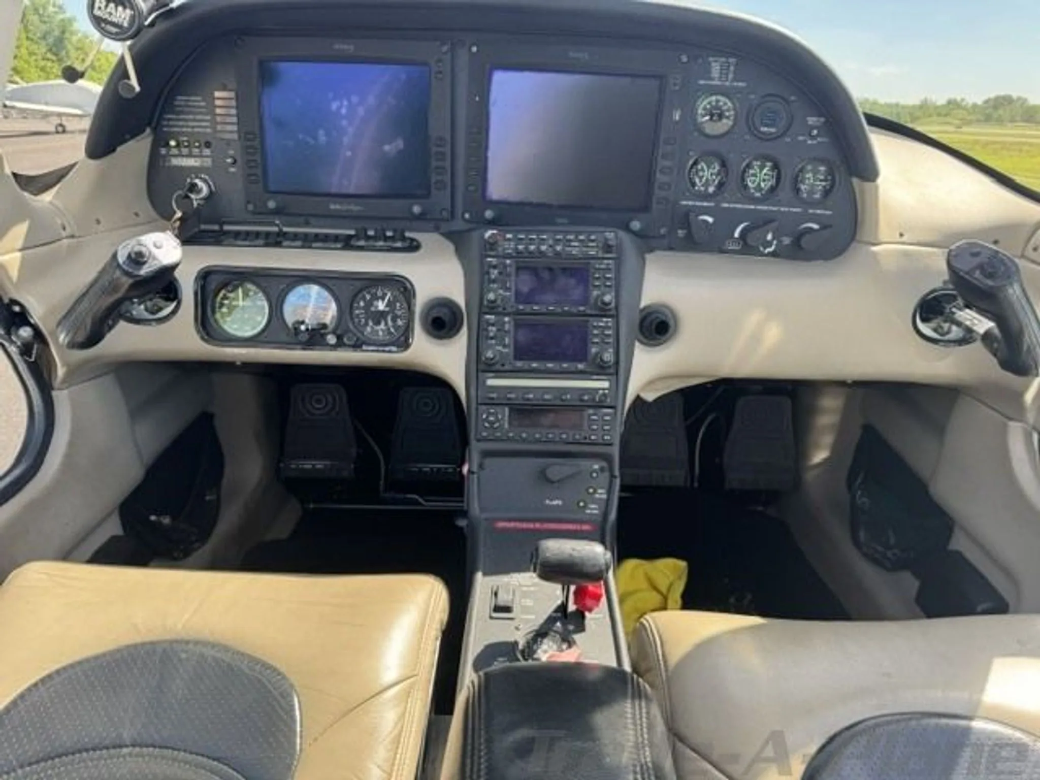 Close-up view of the instrument panel and controls in the cockpit of a Cirrus SR22 aircraft.