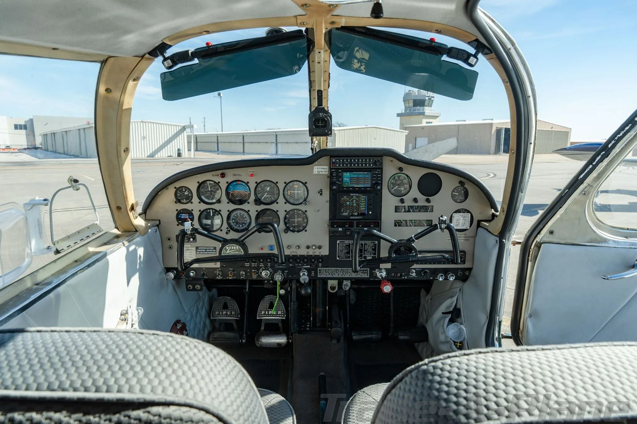 Wide view of the cockpit with instruments.