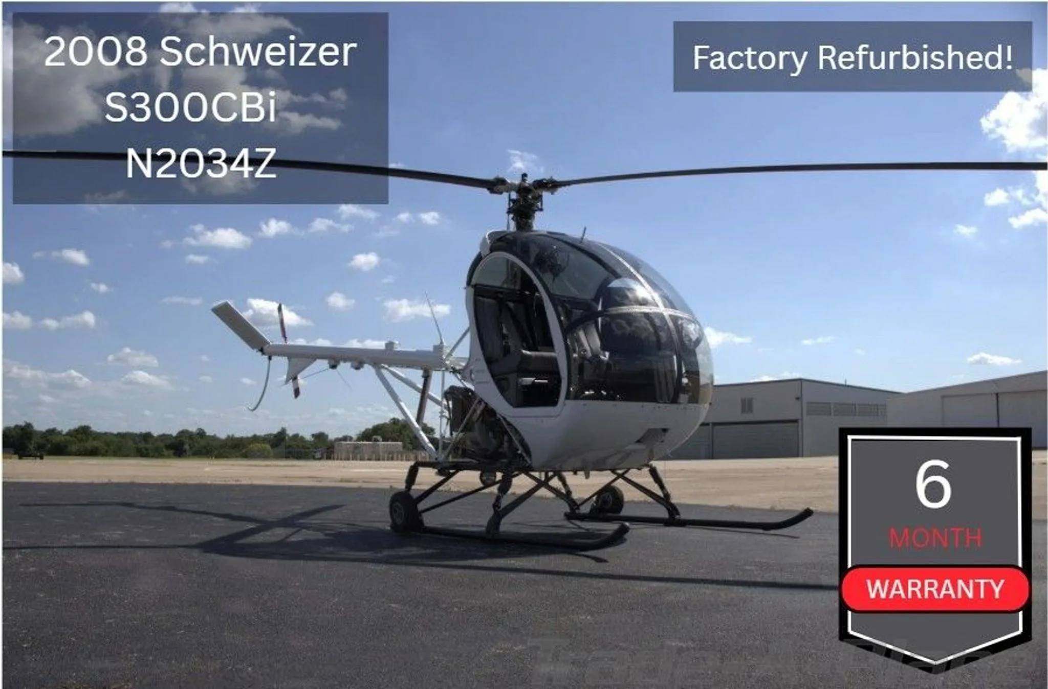 A white 2008 Schweizer S300CBi helicopter, registration N2034Z, is parked on an asphalt tarmac with hangars in the background under a partly cloudy sky.
