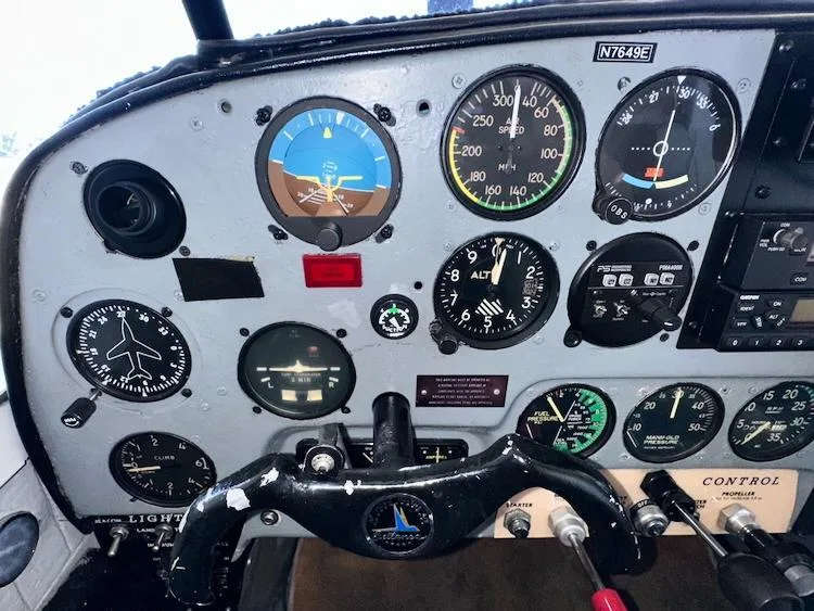 A close-up view of the pilot's side of the Bellanca 7GCBC Citabria N7649E instrument panel, showing flight instruments.