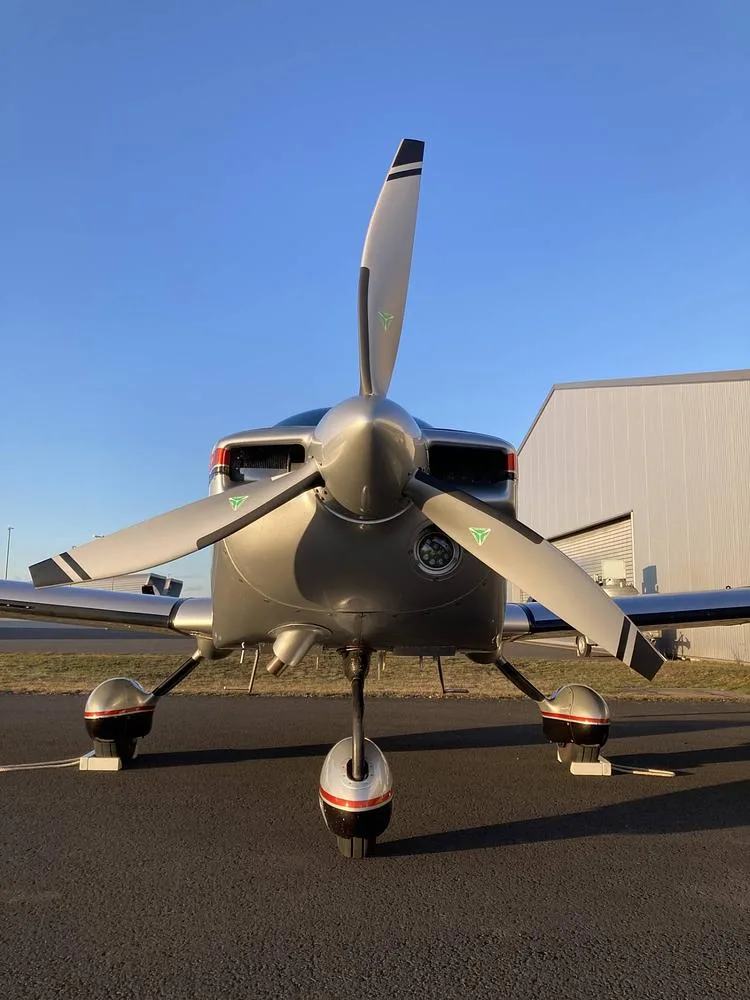 A head-on view of the Grumman American AA-5B Tiger aircraft, N267MT, highlighting its propeller and nose landing gear.