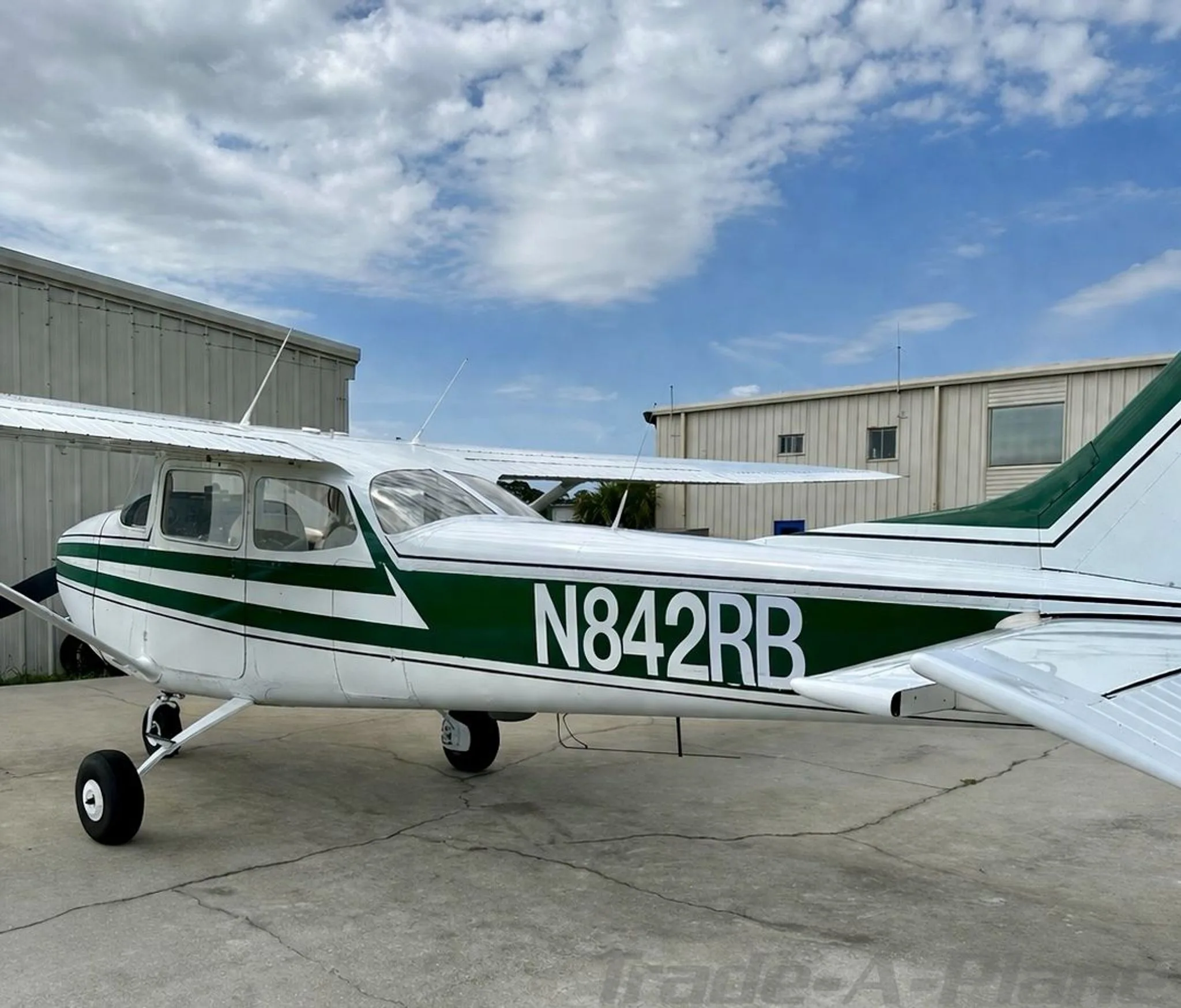 A side view of the Cessna 172K Skyhawk on the ground.