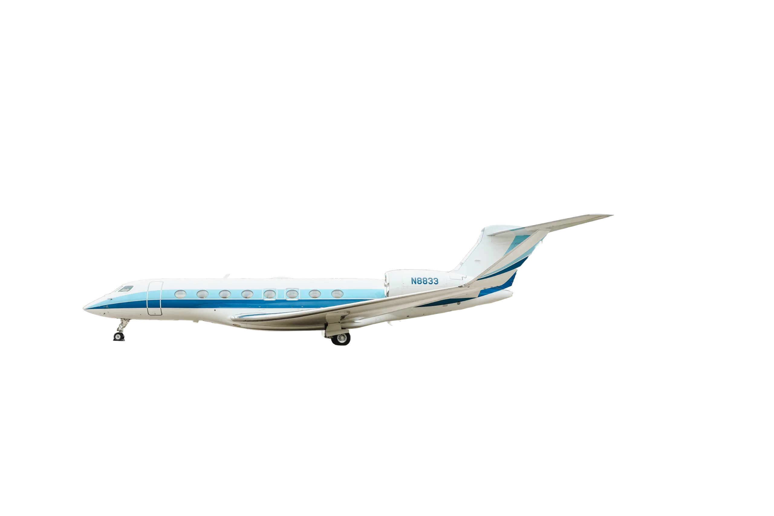 A white and blue business jet with registration N8833 is parked on the tarmac.