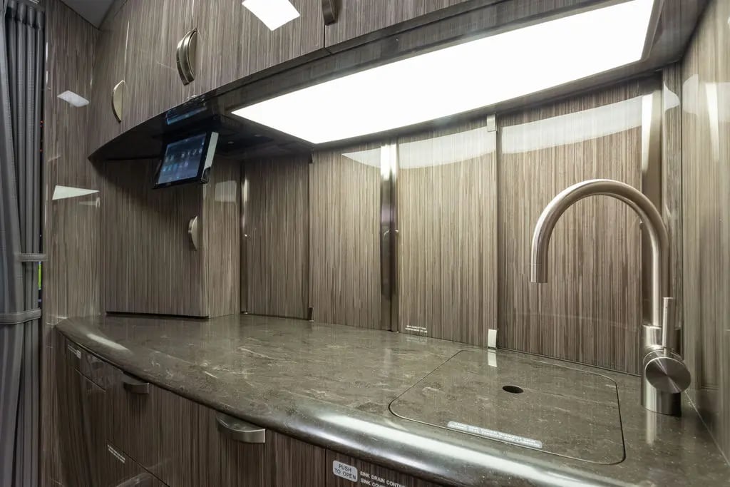 Close-up of the aircraft's galley area with sink and countertop.